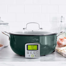 Load image into Gallery viewer, Dark green Greenpan Smart Skillet with light green screen face sitting on light gray and white kitchen countertop; Two stainless steel handles on either side, lid with stainless steel handle on top; 7 round buttons on front below screen face showing time and temperature; &quot;GreenPan&quot; logo above screen on front of skillet