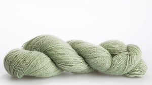 Isager Alpaca 2 yarn in color 46 on white background. Color 46 mostly strands of light mint green