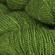 Close up of Jack Pine colored yarn hank; Light deep green in hue