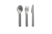 Load image into Gallery viewer, Silver spoon, fork and knife laying on a white background