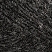 Load image into Gallery viewer, Close up of color 0058. Yarn has strands of black, white, and gray running throughout
