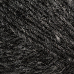 Close up of color 0058. Yarn has strands of black, white, and gray running throughout