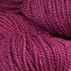 Close up image of Rose Bay colored yarn hank; Dark pink hue