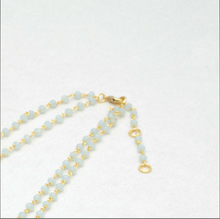 Load image into Gallery viewer, Close up on end of necklace chain showing where clasp meets rings on yellow and blue beaded necklace