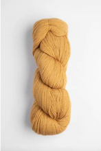 Load image into Gallery viewer, Dark yellow skein of yarn of white background