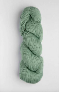 Light mint green skein of yarn on white background