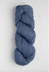Blue skein of yarn on white background