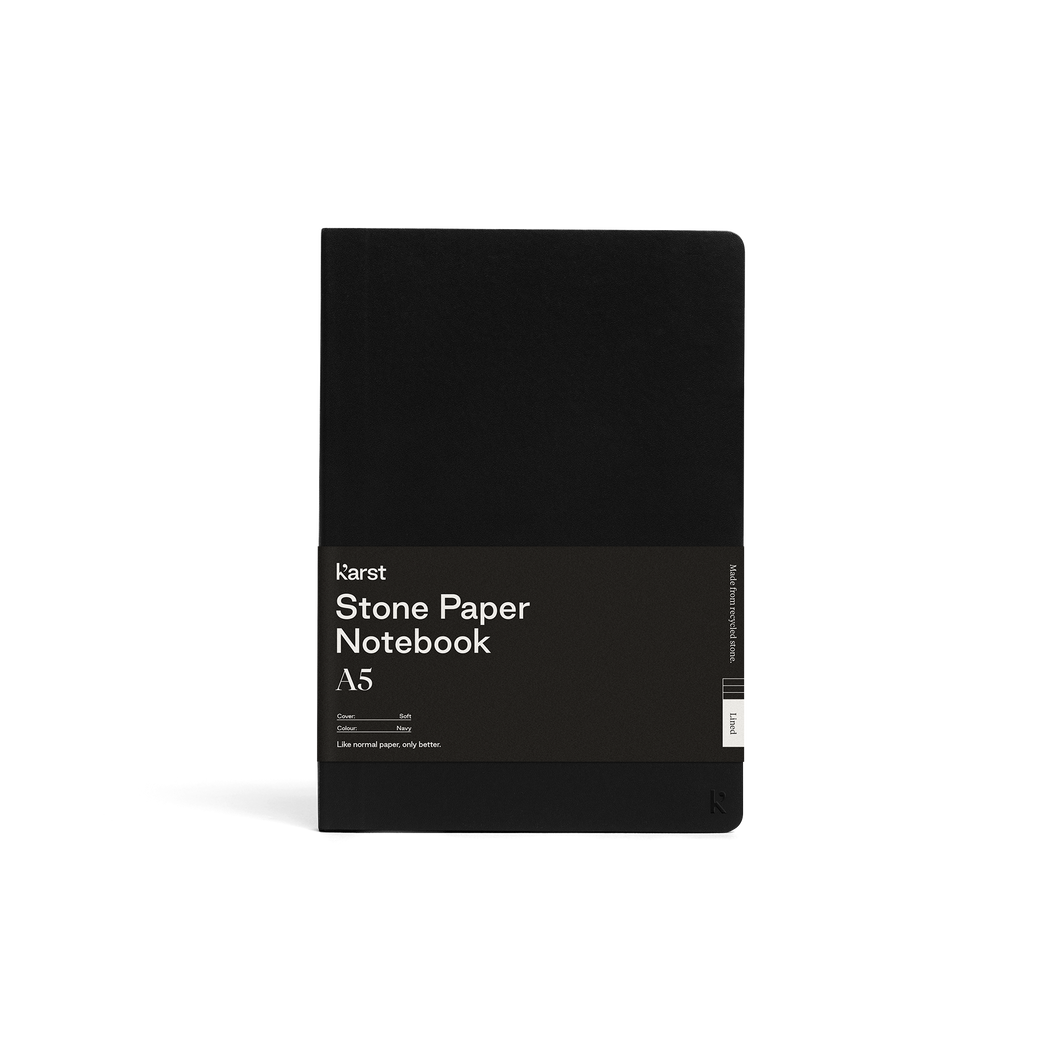 Soft black journal; Large black rectangular paper wrap half way down reads 
