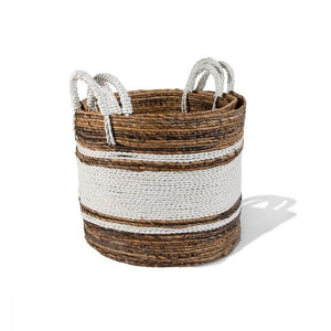 Basket with white wrapped handles. The basket is a varying brown woven basket with three white bands of the same material