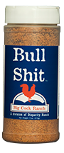 Load image into Gallery viewer, Blue bottle label, white lettering, white cap and red chicken logo. Seasoning name; "Bull shit"