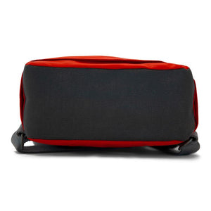 Bottom view of red ORI bag shows gray bottom with gray straps on white background
