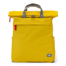 Load image into Gallery viewer, Yellow ORI backpack with gray handles at top and two red zipper tabs on side on white background