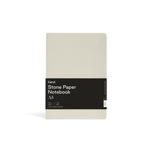 Load image into Gallery viewer, Smooth light gray/ tan journal; Large black rectangular paper wrap half way down reads &quot;KARST&quot; &quot;Stone paper Notebook &quot;A5&quot; on right side; Small &quot;K&quot; stamped in bottom right side corner
