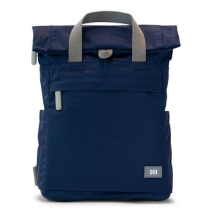 Navy blue ORI bag with gray handles and gray zipper tabs on white background