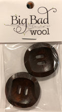 Load image into Gallery viewer, Image of two round dark brown wood buttons in small plastic package that reads "Big Bad Wool." Each button has two long holes in middle